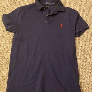 I am selling men's Ralph Lauren polo shirt in a navy blue that is short sleeve